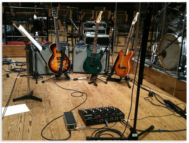 stage setup with guitars and pedals